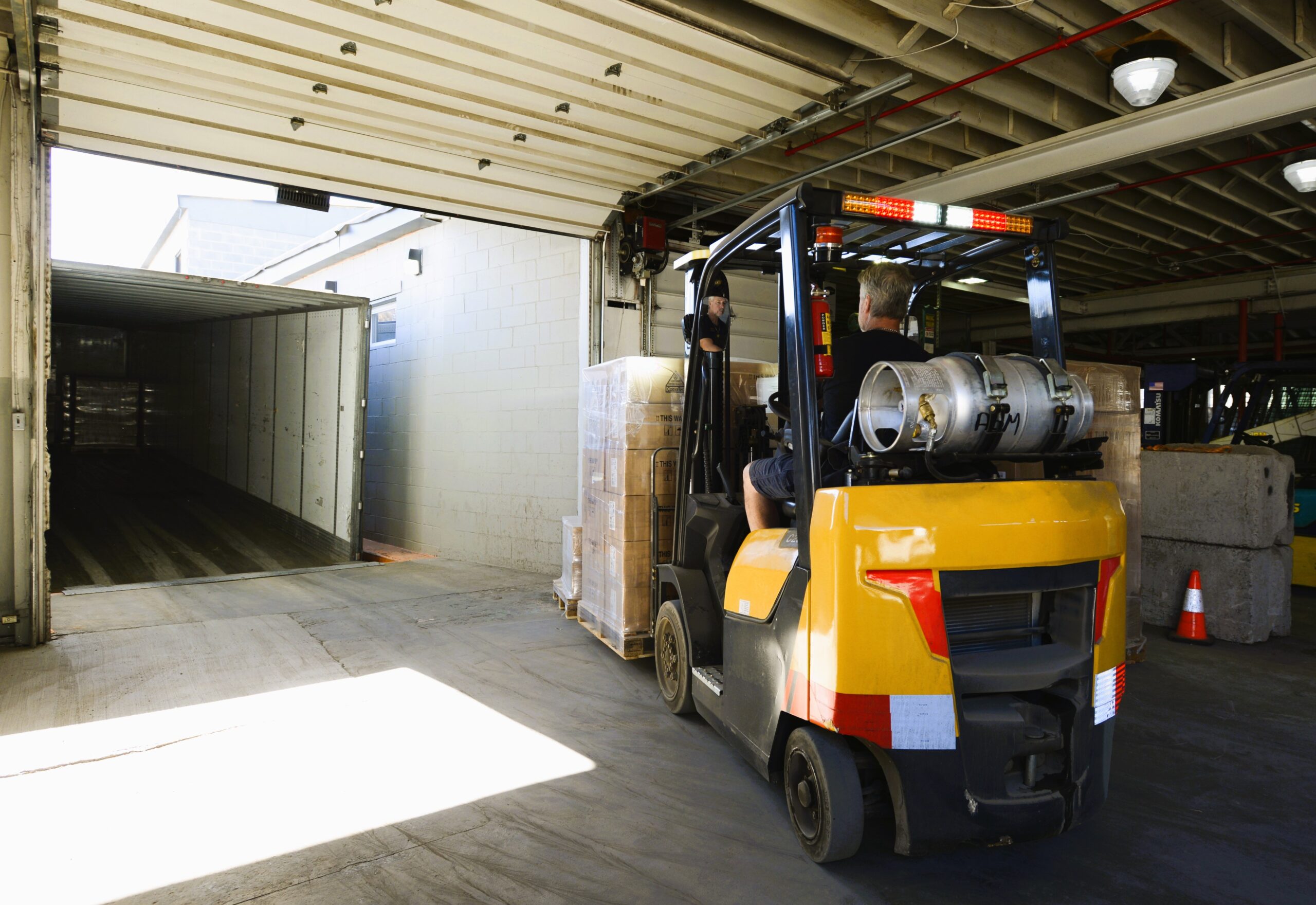A forklift inside a warehouse.